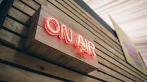 On Air sign on the Rising Minds Radio Booth - cover image for post on young people's mental health
