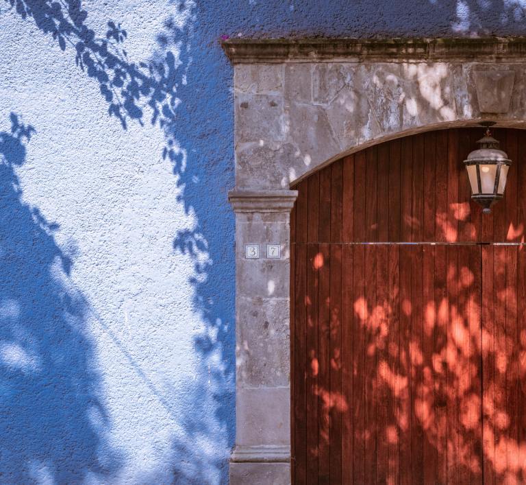 A red door of a blue house in Mexico City. Femicides increase in Mexico