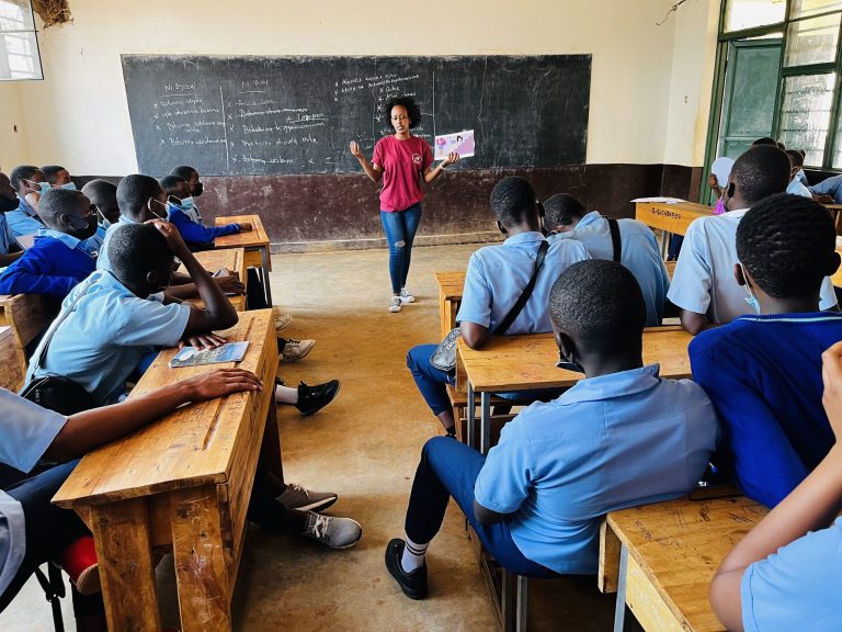 Sharon hosting an educational session at a school in Kigali.