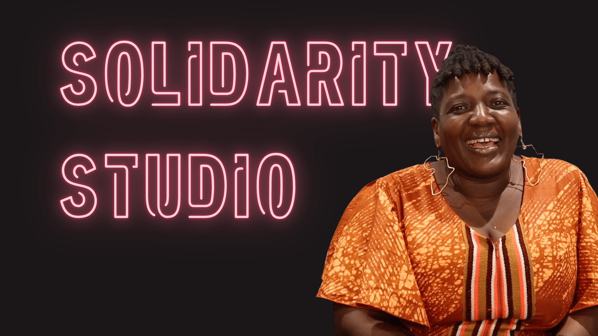 Pink neon text on Black background with the words SOLIDARITY STUDIO and the profile of Amé Atsu David in an orange tunic.