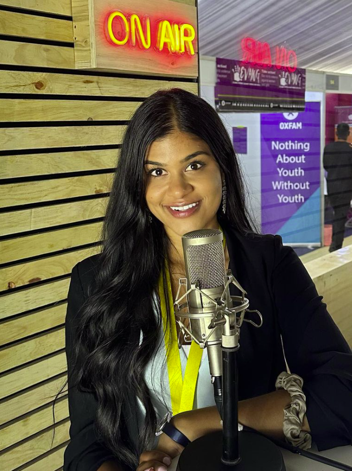Aditi Sivakumar at the Rising Minds radio station at Women Deliver 2023, speaking about 1.8 Billion Campaign and youth leaderhsip.
